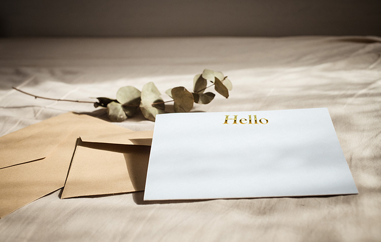 Envelope and card with the word hello